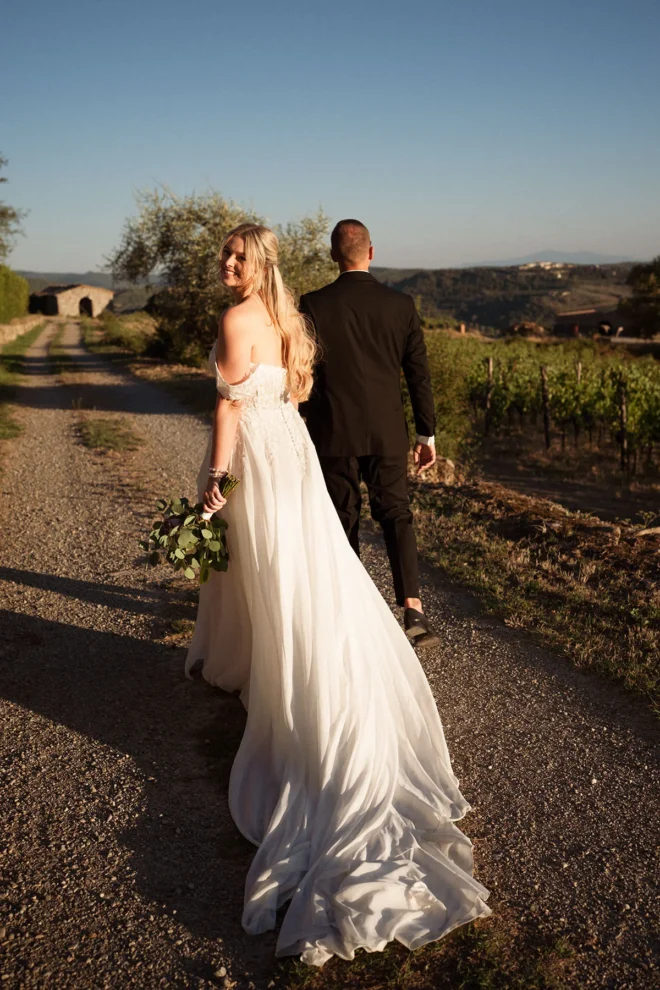 Beautiful candid moment during a wedding at Borgo Castelvecchi at golden hour.