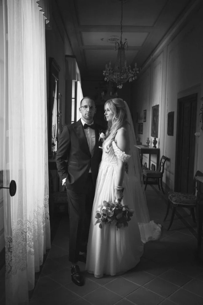 Beautiful black couple in an elegant portrait at the majestic Borgo Castelvecchi. Tuscany wedding photographer.